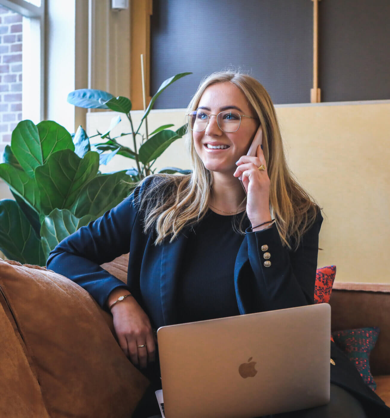 Woman talking on the phone during a healthcare staffing meeting