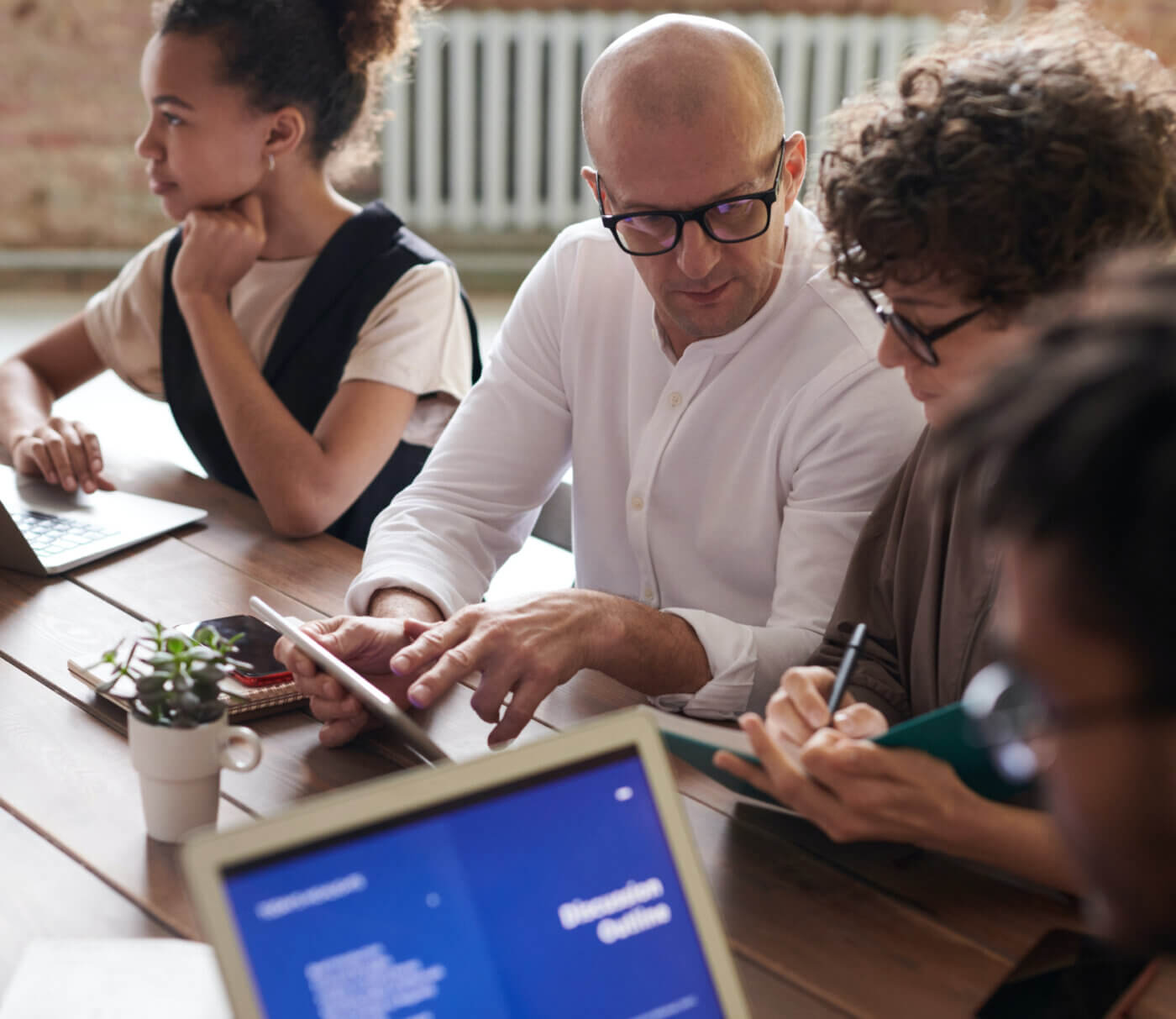 Group of staffing services employees at an office table